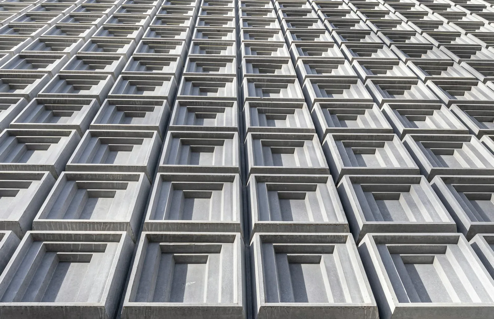 Your Homepage Says AI-Powered 14 Times. So Does Every Competitor. — Low angle shot of a modern building facade in Chur with g…