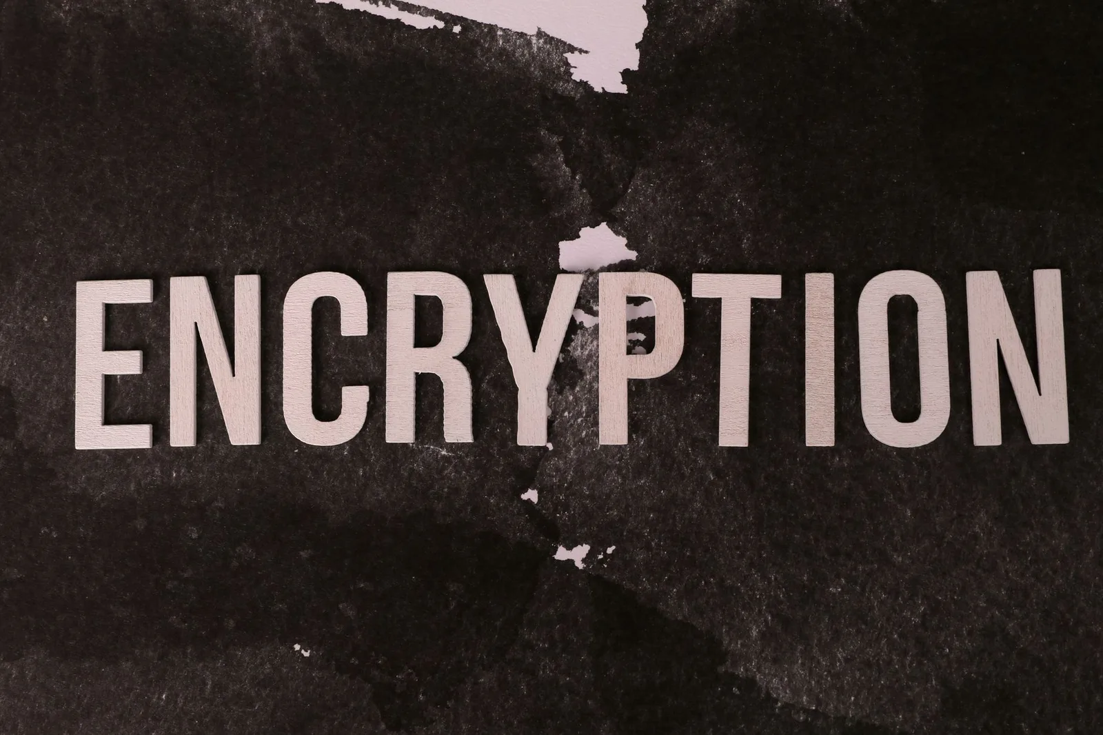 Best AI SPM Tools in 2026 — Black and white abstract image with the word 'ENCRYPTION' prominently displayed.