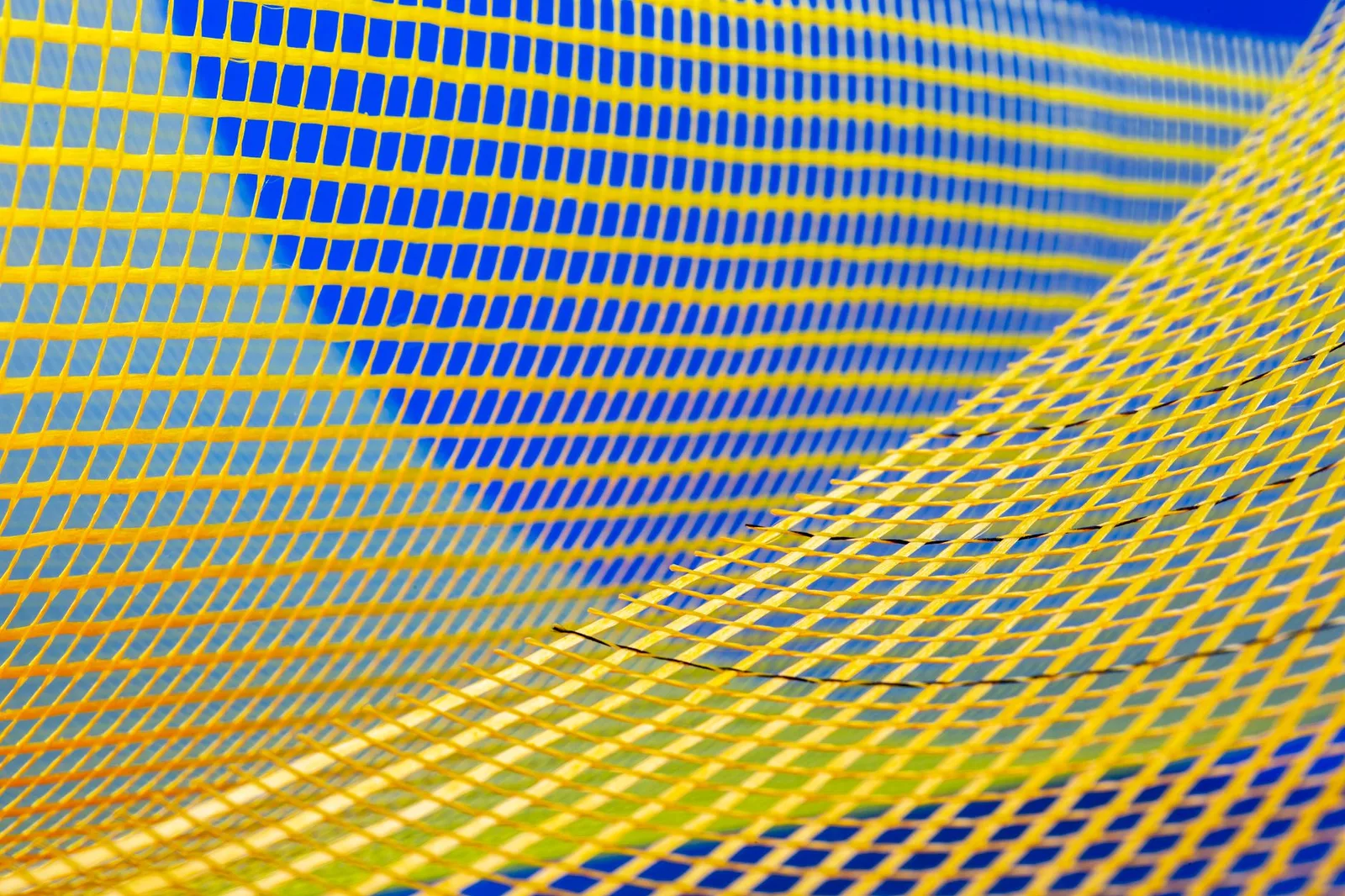 Best Secure Access Service Edge Tools in 2026 — Abstract image with vibrant yellow and blue mesh pattern creating a dynamic v…