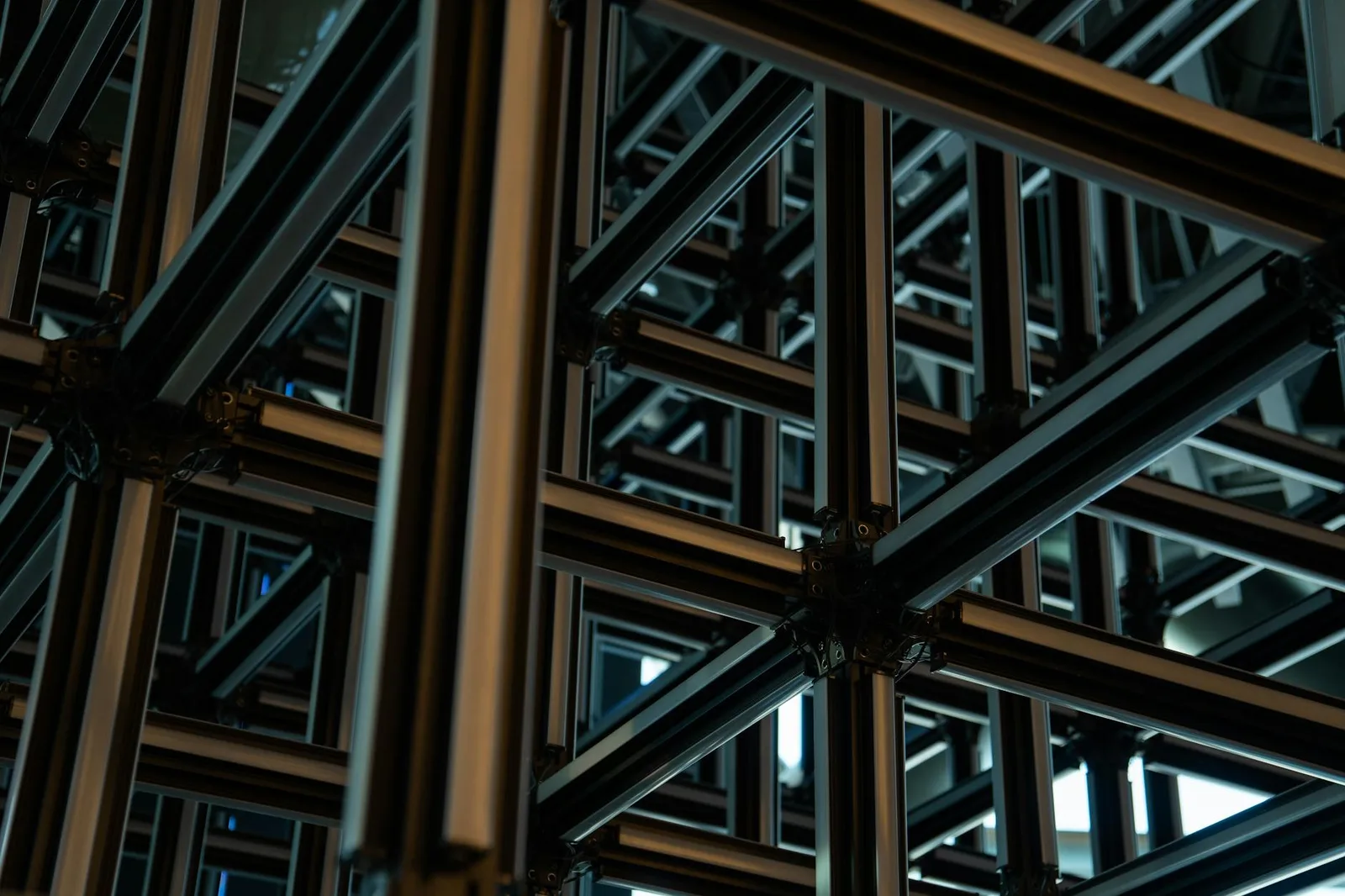 Building a Protect Program With a Team of 5 — Intricate steel lattice structure showcasing modern geometric industrial design…