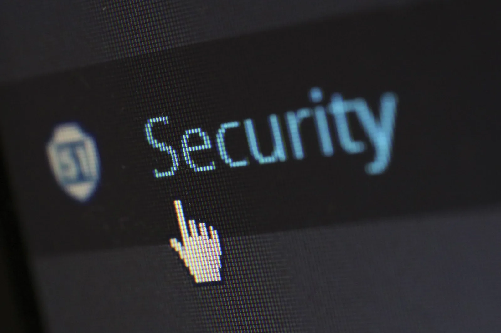 Best Cloud Security Tools in 2026 — Close-up view of a mouse cursor over digital security text on display.