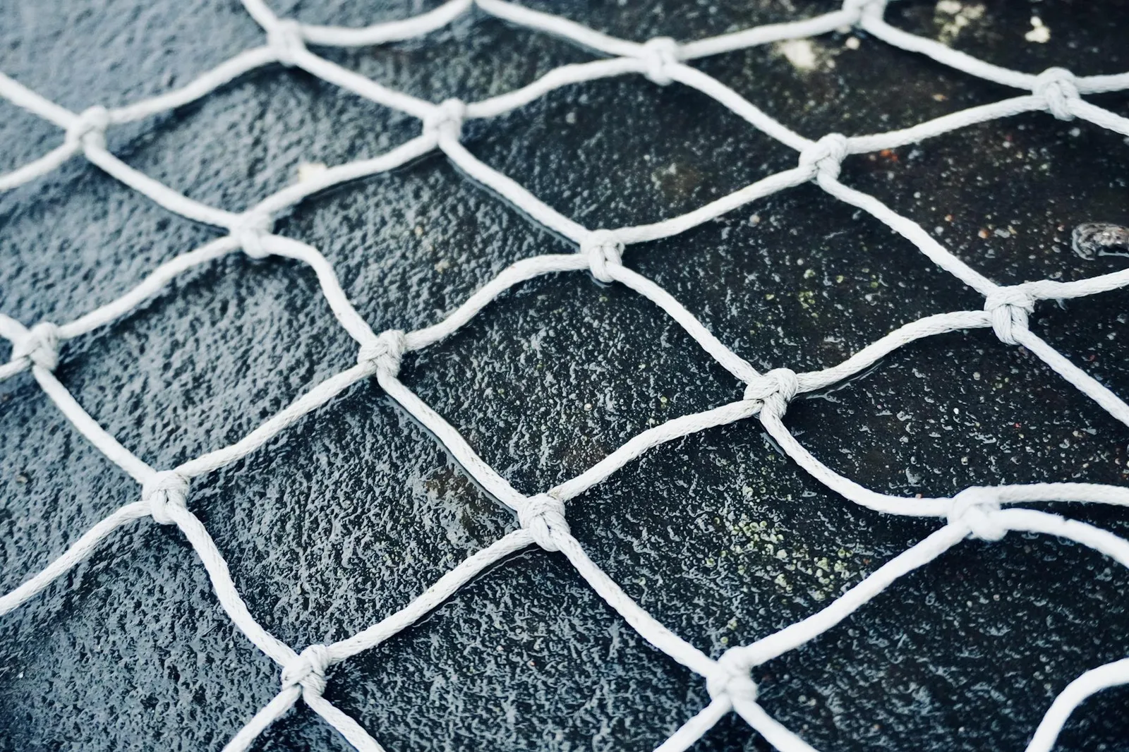 Cold Emails Get Deleted on Sight. Here Is What CISOs Actually Read. — High-resolution close-up of white netting against a dar…