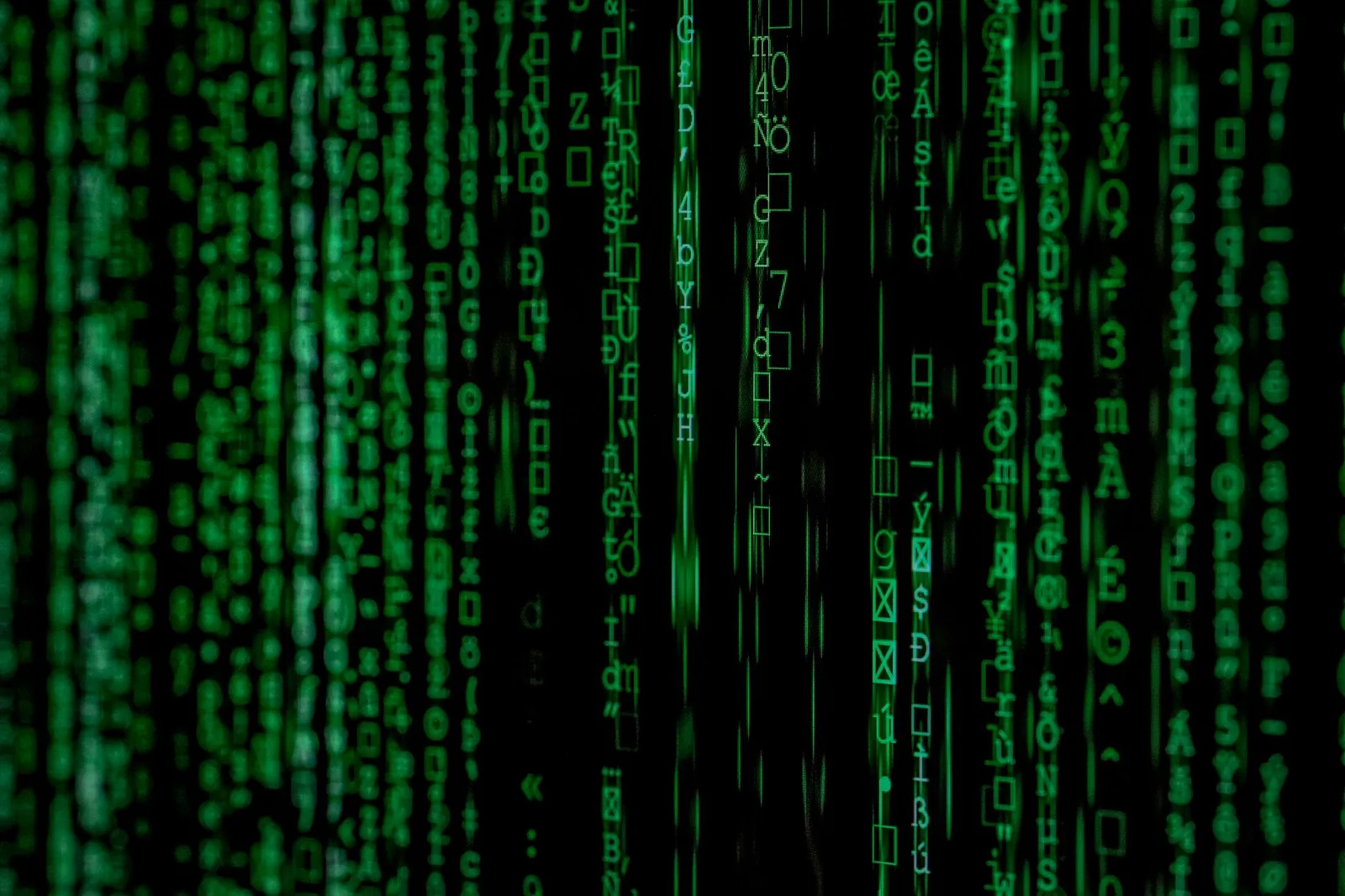 Best Email DLP Tools in 2026 — Abstract green matrix code background with binary style.