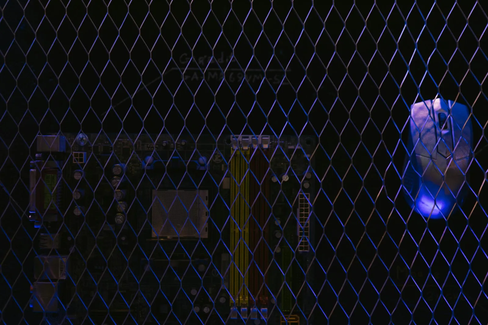 Best Next-Generation Firewalls Tools in 2026 — Artistic image featuring a circuit board viewed through a wire mesh, highlight…