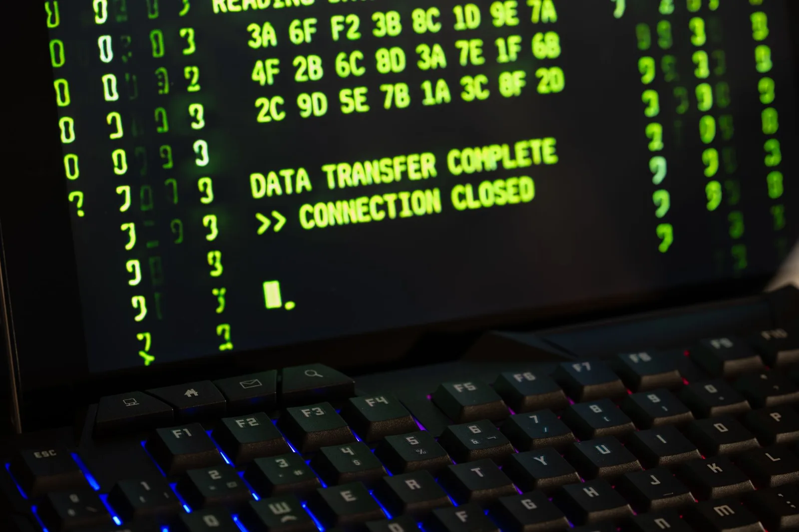 Best Next-Gen Firewalls in 2026 — Data transfer complete message displayed on a computer monitor with a keyboard underneath.