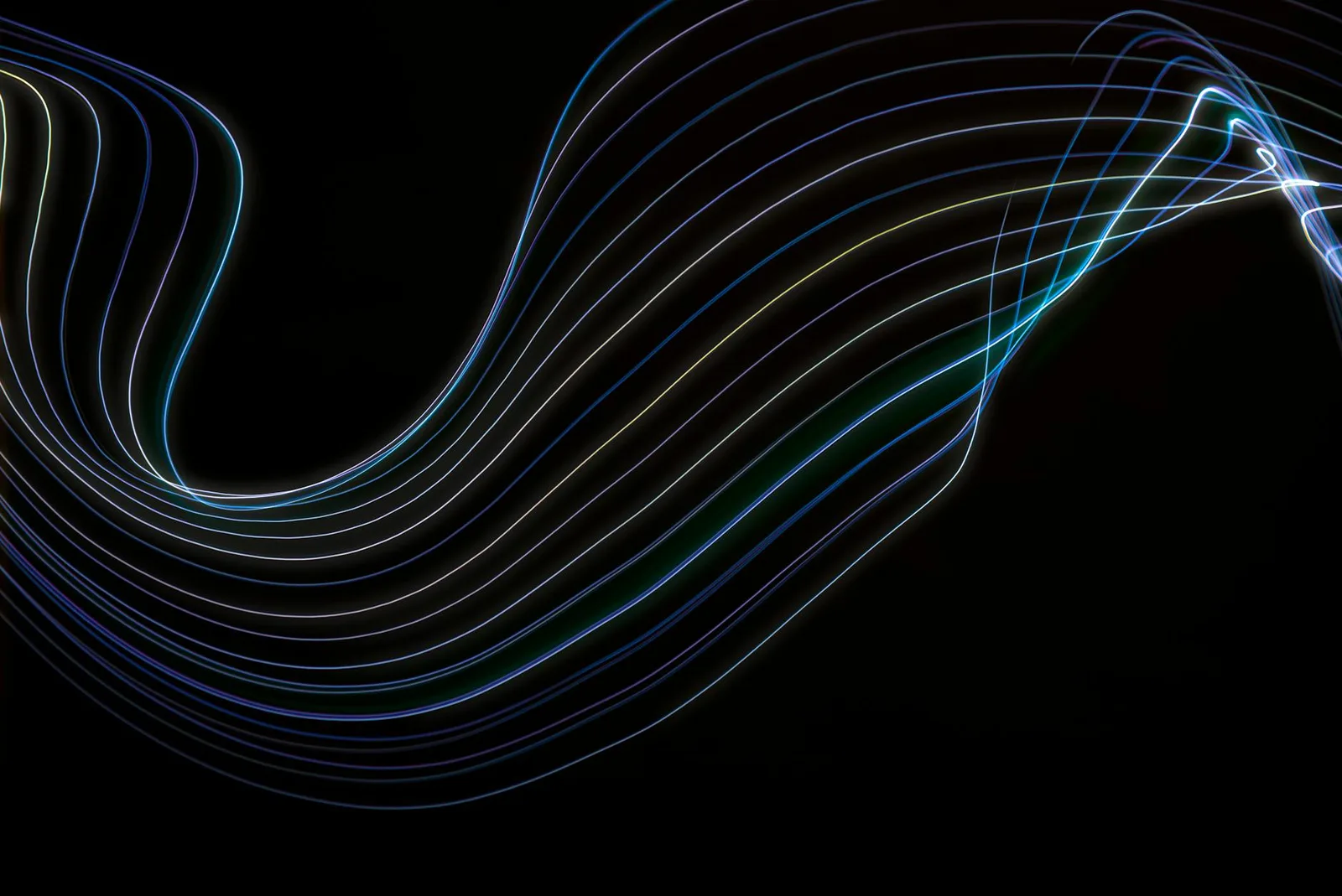 The Quarterly Access Review Is Broken. Here Is What to Do Instead. — A captivating abstract image featuring colorful light wa…