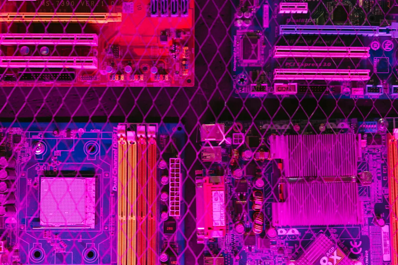 Best Zero Trust Network Access Tools in 2026: Top 7 Compared — Colorful circuit boards behind a wire mesh, enhanced with pink…
